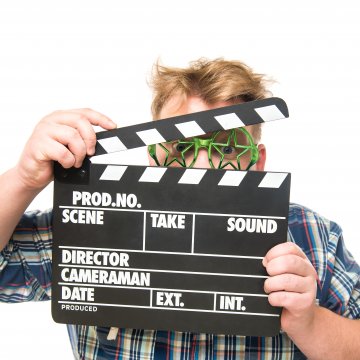 man holding clapperboard video editing software